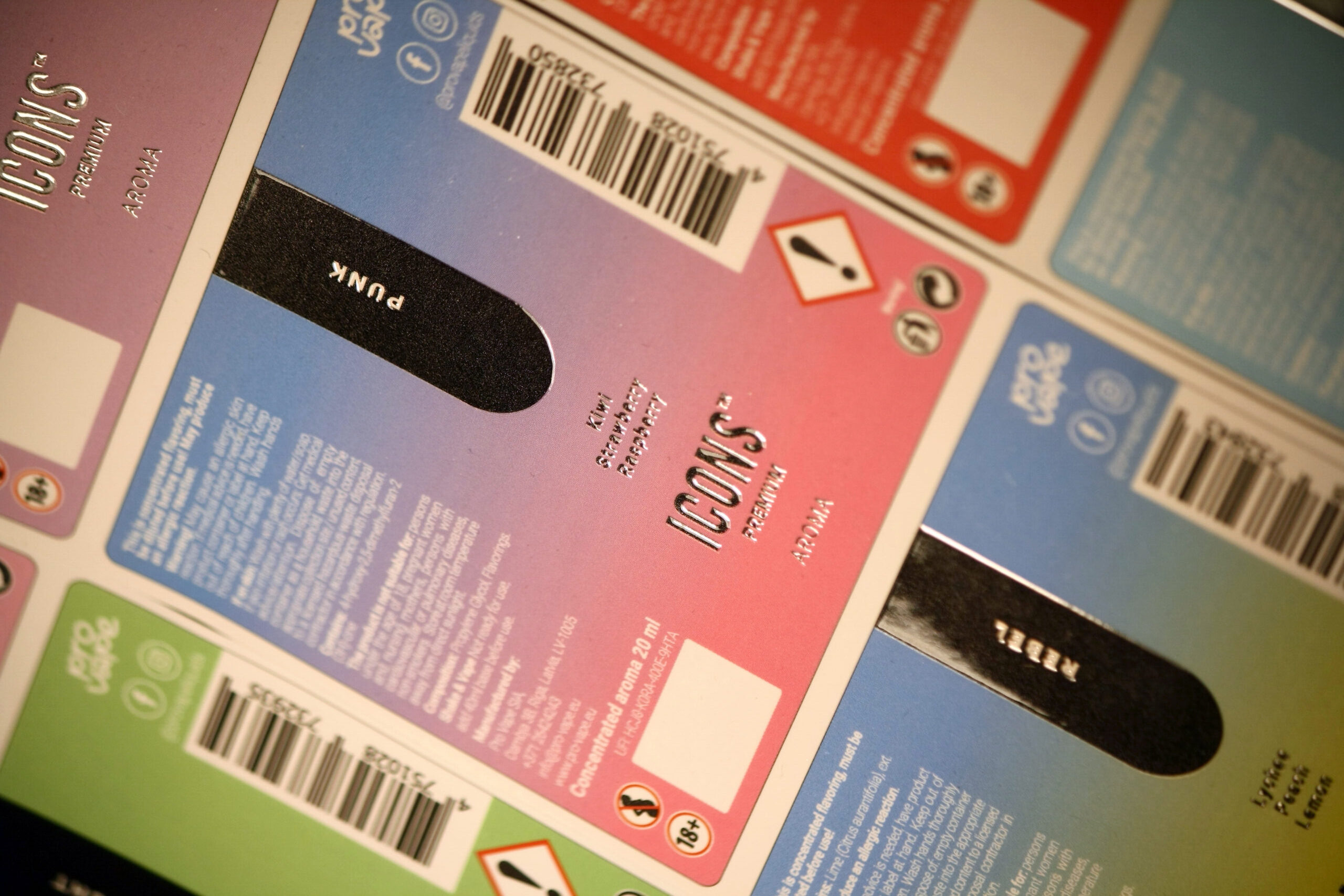 Colorful screen-printed labels with raised relief and warning signs, suitable for marking various products.